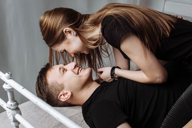 Couple Kissing on The Bed